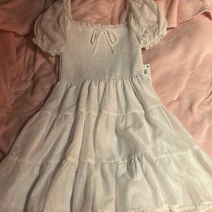 Brand is crystal doll it’s a xs white